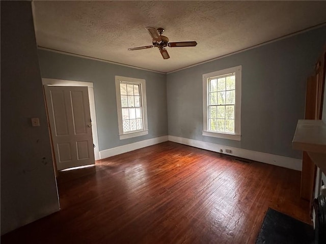 29 Ivy St, Porterdale, GA 30014 - empty room featuring healthy amount of natural light, wood finished floors, baseboards, a textured ceiling, and a ceiling fan