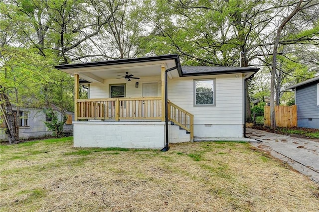 538 Center Hill Ave NW, Atlanta, GA 30318 - view of front of home featuring a porch, ceiling fan, crawl space, fence, and a front lawn