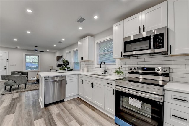 538 Center Hill Ave NW, Atlanta, GA 30318 - kitchen with a sink, open floor plan, white cabinets, and stainless steel appliances