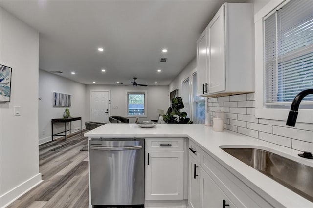 538 Center Hill Ave NW, Atlanta, GA 30318 - kitchen with dishwasher, a sink, a ceiling fan, a peninsula, and white cabinetry