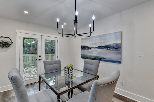 538 Center Hill Ave NW, Atlanta, GA 30318 - dining space featuring french doors, an inviting chandelier, baseboards, and wood finished floors