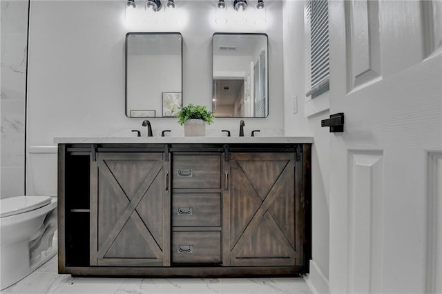 538 Center Hill Ave NW, Atlanta, GA 30318 - bathroom with a sink, toilet, double vanity, and marble finish floor
