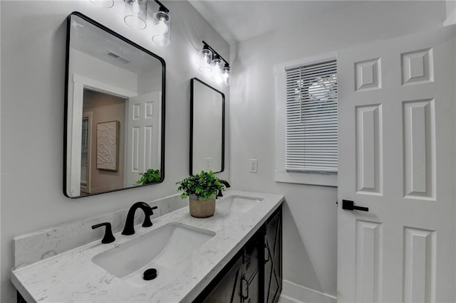 538 Center Hill Ave NW, Atlanta, GA 30318 - full bathroom featuring double vanity, visible vents, and a sink