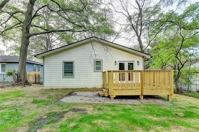 538 Center Hill Ave NW, Atlanta, GA 30318 - back of property featuring a yard, a wooden deck, and fence