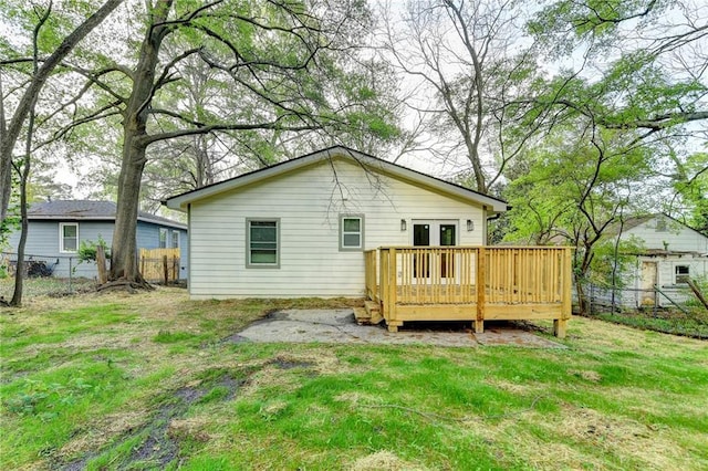 538 Center Hill Ave NW, Atlanta, GA 30318 - back of property featuring french doors, fence, a deck, and a lawn