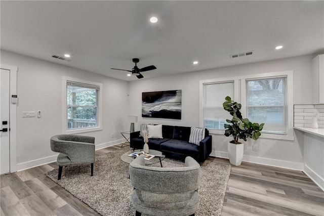 538 Center Hill Ave NW, Atlanta, GA 30318 - living area featuring wood finished floors, visible vents, and recessed lighting