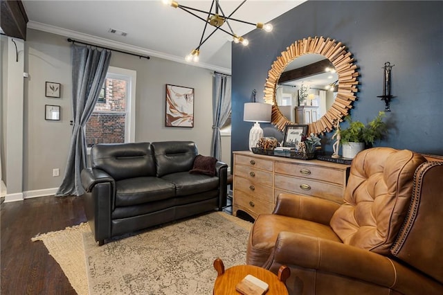 living room featuring ornamental molding, dark hardwood / wood-style flooring, and a chandelier