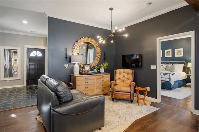 living room featuring ornamental molding, dark hardwood / wood-style floors, and a chandelier