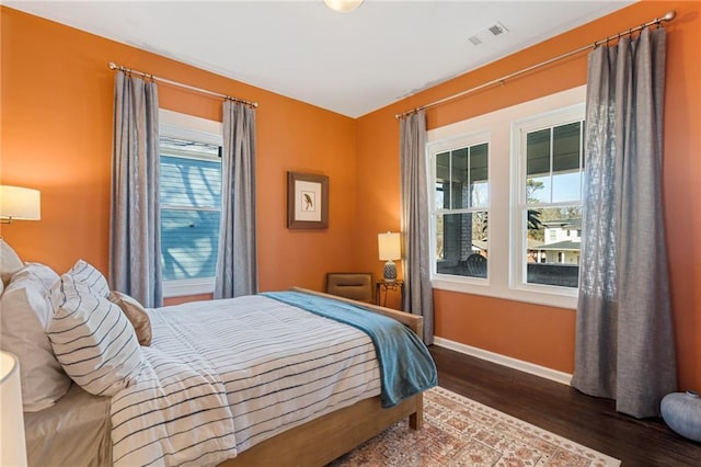 bedroom featuring dark hardwood / wood-style flooring