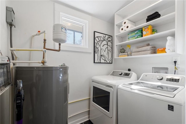 clothes washing area with washing machine and dryer and electric water heater