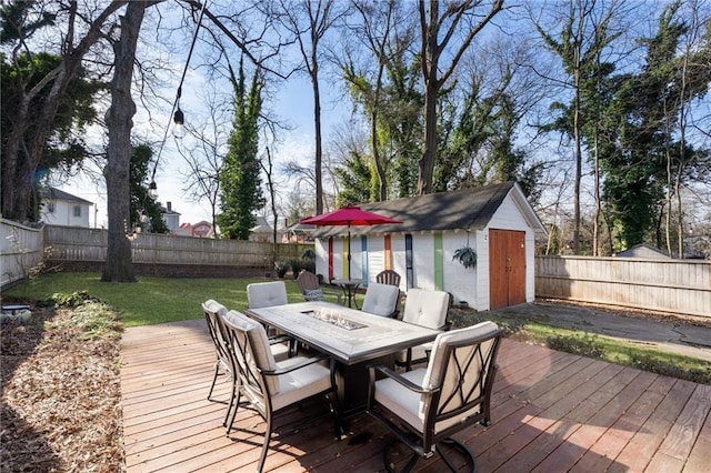 deck featuring a lawn and a shed