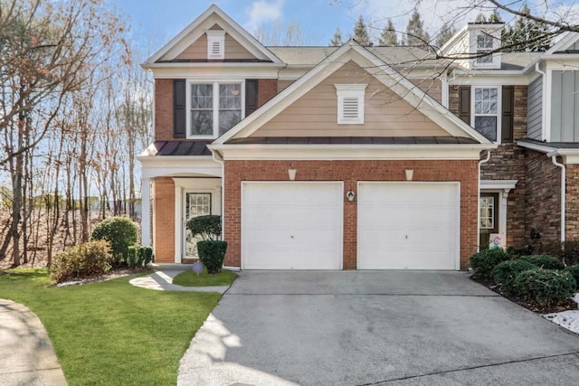 view of front of home featuring a front yard and a garage