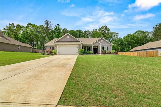 137 Evergreen Ridge Ct, Statham, GA 30666 - view of front facade featuring board and batten siding, an attached garage, driveway, and brick siding