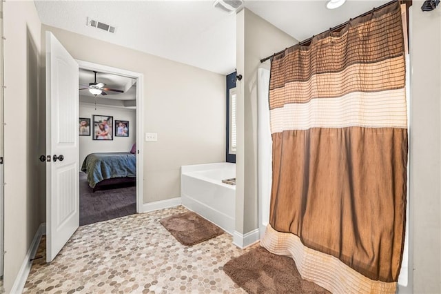 137 Evergreen Ridge Ct, Statham, GA 30666 - bathroom featuring a ceiling fan, a garden tub, baseboards, and ensuite bath