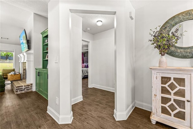 137 Evergreen Ridge Ct, Statham, GA 30666 - corridor with wood finished floors, a textured ceiling, and baseboards