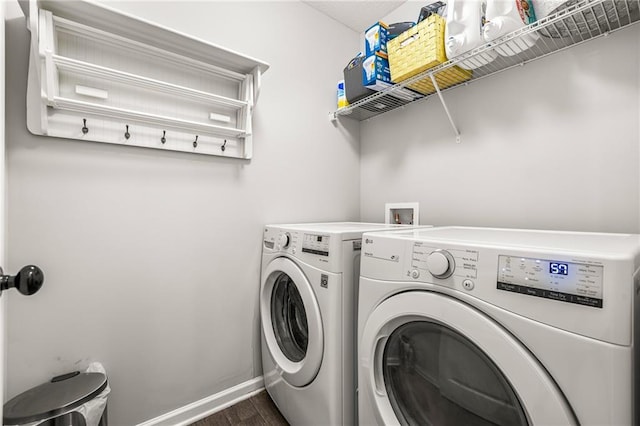 137 Evergreen Ridge Ct, Statham, GA 30666 - laundry room with washing machine and clothes dryer, dark wood-style floors, and baseboards
