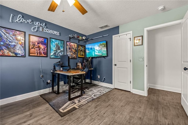 137 Evergreen Ridge Ct, Statham, GA 30666 - office area with wood finished floors, a textured ceiling, baseboards, and a ceiling fan