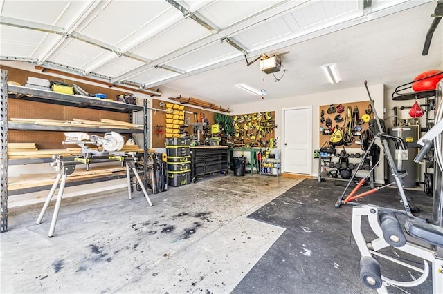 137 Evergreen Ridge Ct, Statham, GA 30666 - garage featuring a workshop area, a garage door opener, and water heater