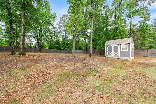 137 Evergreen Ridge Ct, Statham, GA 30666 - fenced backyard with view of wooded area, an outdoor structure, and a storage shed