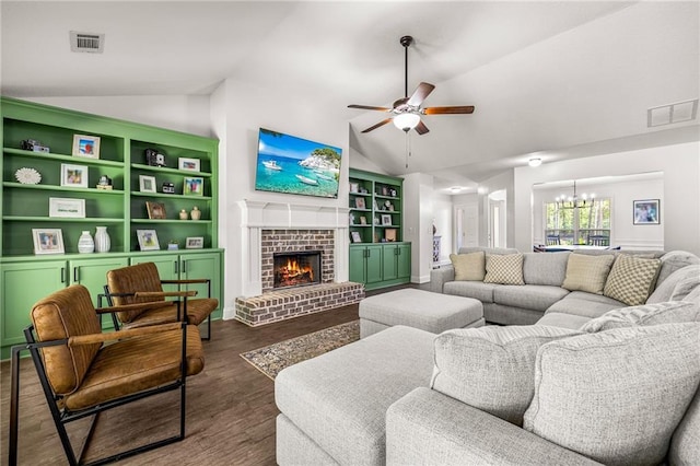 137 Evergreen Ridge Ct, Statham, GA 30666 - living area with lofted ceiling, ceiling fan, a chandelier, wood finished floors, and a fireplace