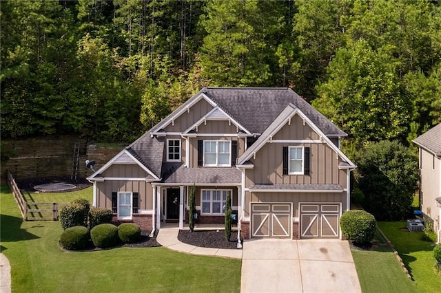 view of front of house with a garage and a front lawn