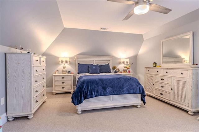 bedroom with vaulted ceiling, light carpet, and ceiling fan