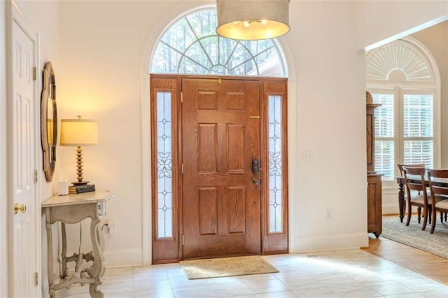 entryway with plenty of natural light and a high ceiling