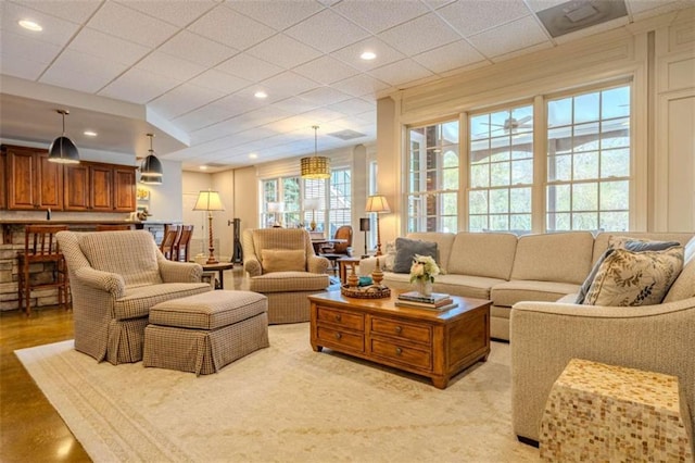 living room featuring a drop ceiling