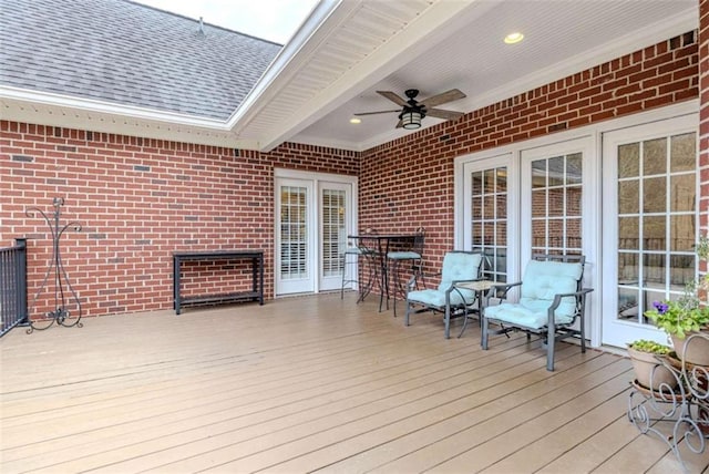 wooden deck featuring ceiling fan