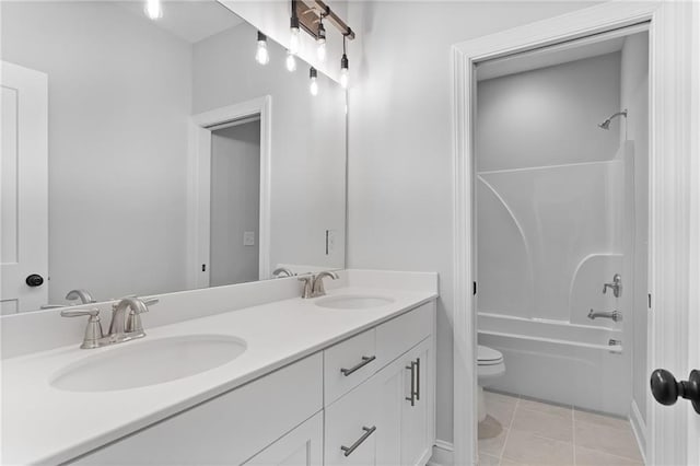 full bathroom with tile patterned floors, toilet, shower / tub combination, and dual bowl vanity