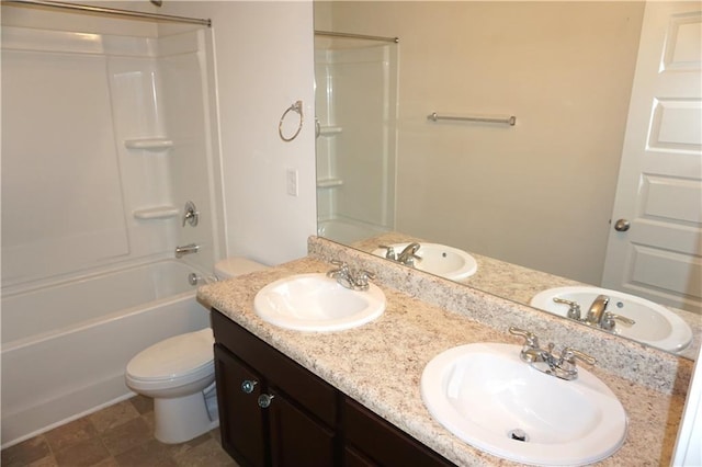 full bath featuring a sink, bathing tub / shower combination, and toilet