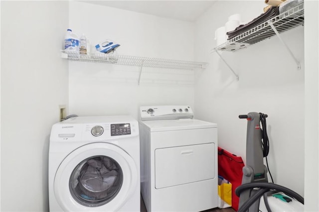 laundry area with laundry area and washing machine and clothes dryer