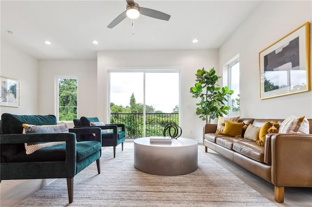 living room featuring hardwood / wood-style flooring and ceiling fan