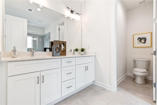 bathroom with tile patterned flooring, vanity, toilet, and a shower with door