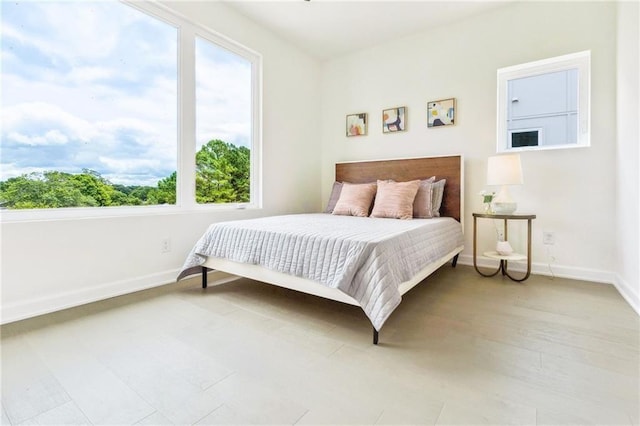 bedroom with light hardwood / wood-style flooring