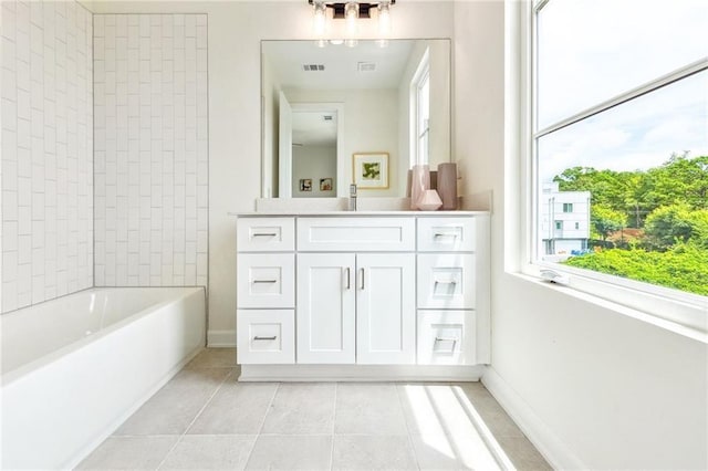 bathroom featuring tile patterned flooring and vanity