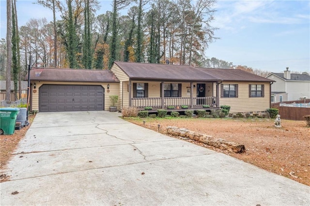 ranch-style house with a porch and a garage