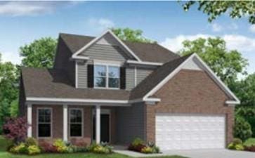 view of front of house with an attached garage and driveway