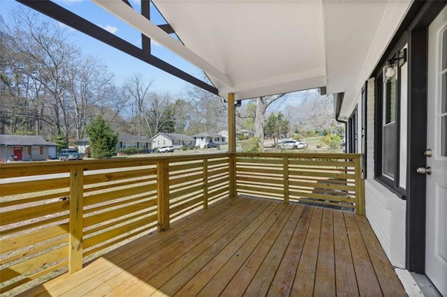 wooden deck featuring a residential view