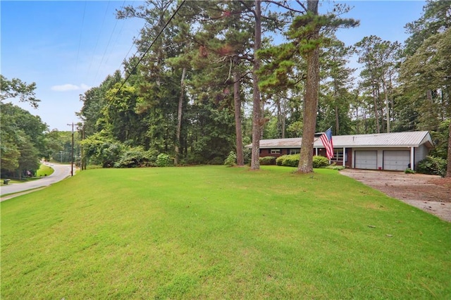 view of front of home featuring a garage and a front lawn