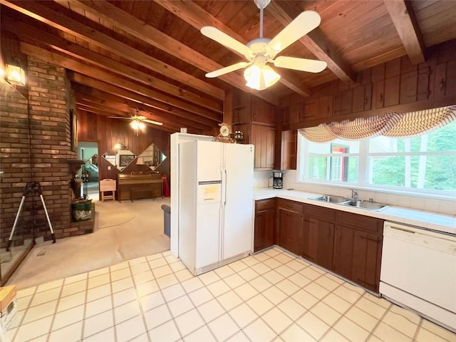 kitchen featuring wooden ceiling, vaulted ceiling with beams, sink, light colored carpet, and white appliances