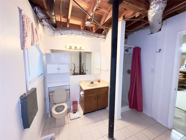 bathroom with vanity, walk in shower, toilet, and tile patterned floors