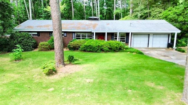 ranch-style home with a front lawn and a garage