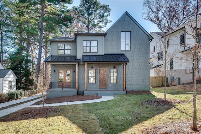 modern inspired farmhouse featuring a porch and a front lawn