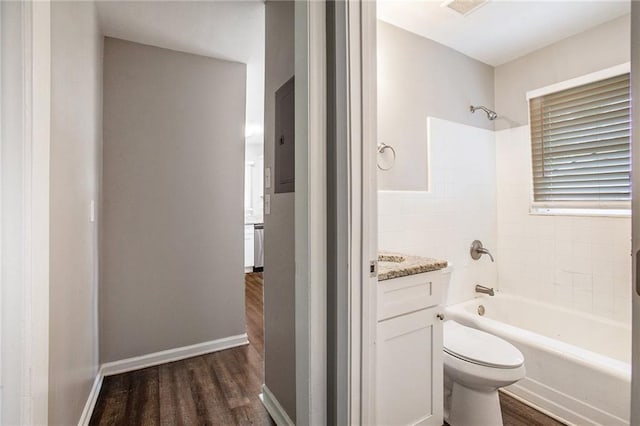 full bathroom featuring hardwood / wood-style floors, shower / tub combination, vanity, and toilet