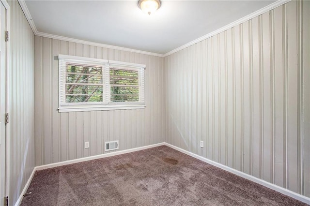 carpeted spare room with crown molding