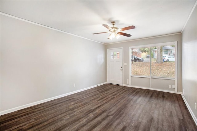 spare room with ceiling fan, dark hardwood / wood-style floors, and crown molding