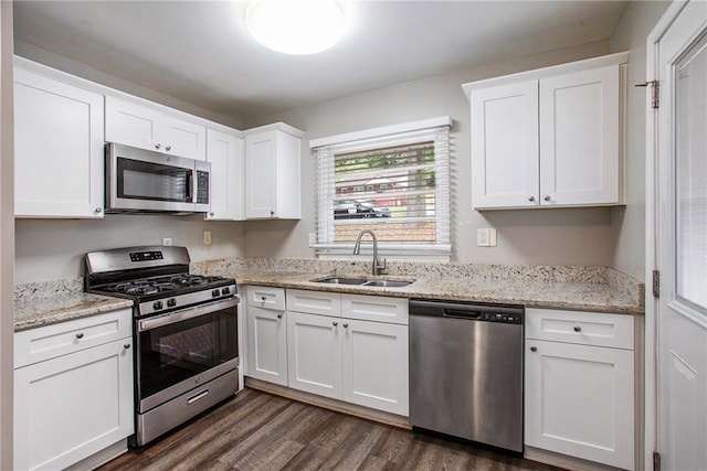 kitchen with white cabinetry, appliances with stainless steel finishes, and sink