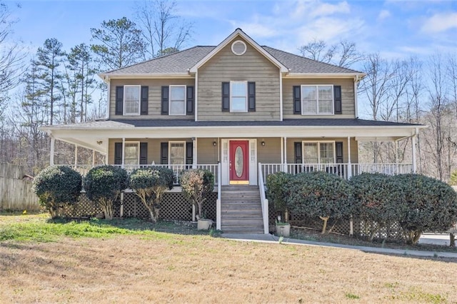 farmhouse-style home featuring a porch and a front lawn