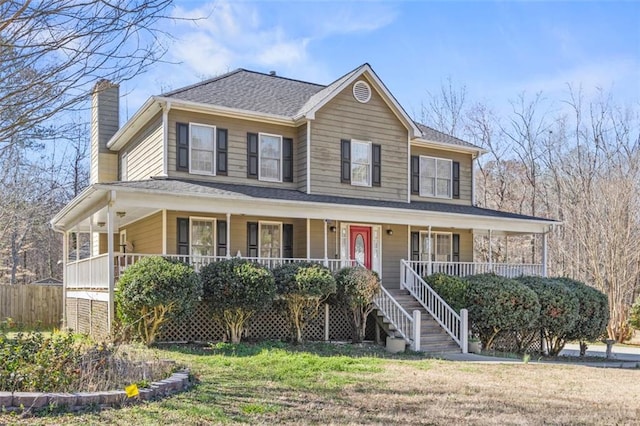 farmhouse-style home featuring a porch, a chimney, and a front lawn